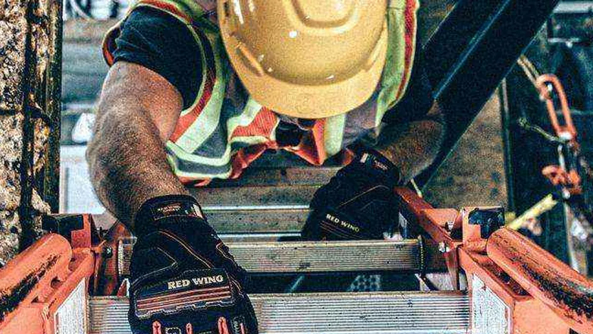 Construction worker with yellow safety helmet