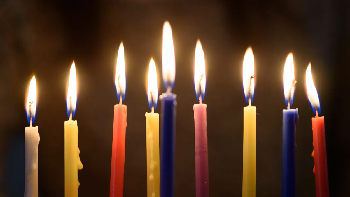 Close-up of lit Hanukkah candles