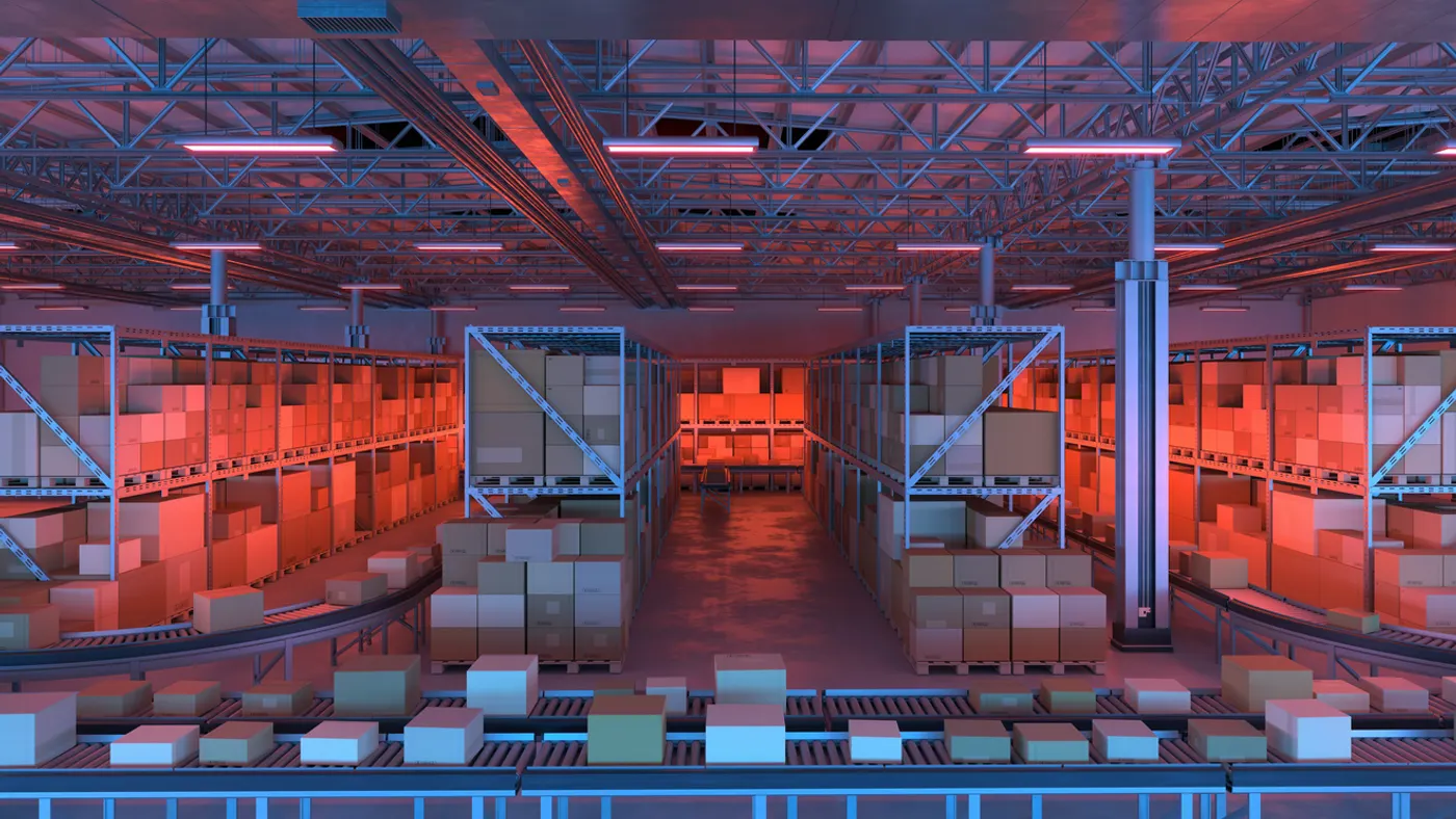 Large distribution warehouse full of shipping boxes on conveyor belts