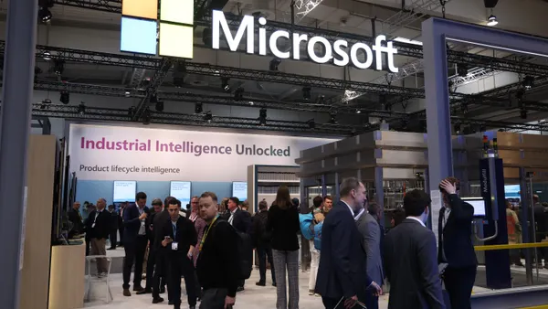 Visitors crowd the Microsoft exhibition stand at the 2026 Hannover Messe industrial trade fair on April 20, 2026 in Hanover, Germany. This