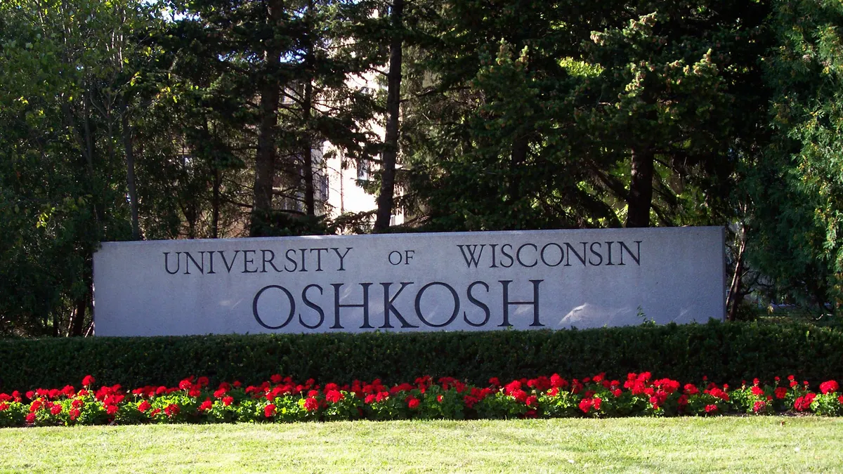 A sign at the University of Wisconsin Oshkosh displaying the institution's name.