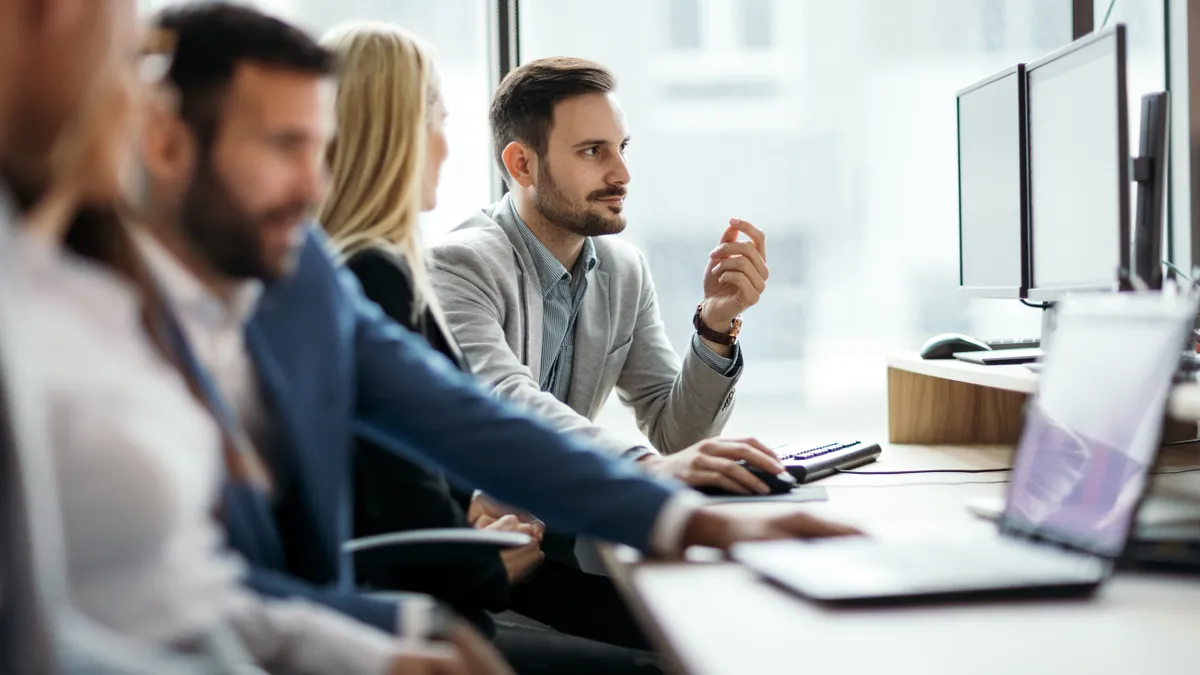 Picture of business people working together in office