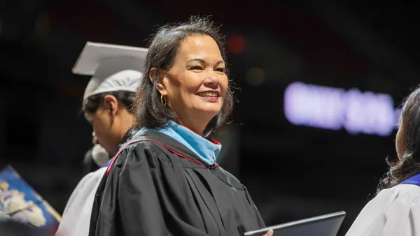 Jhone Ebert, superintendent of the Clark County School District in Nevada, is pictured attending a high school graduation ceremony at night.