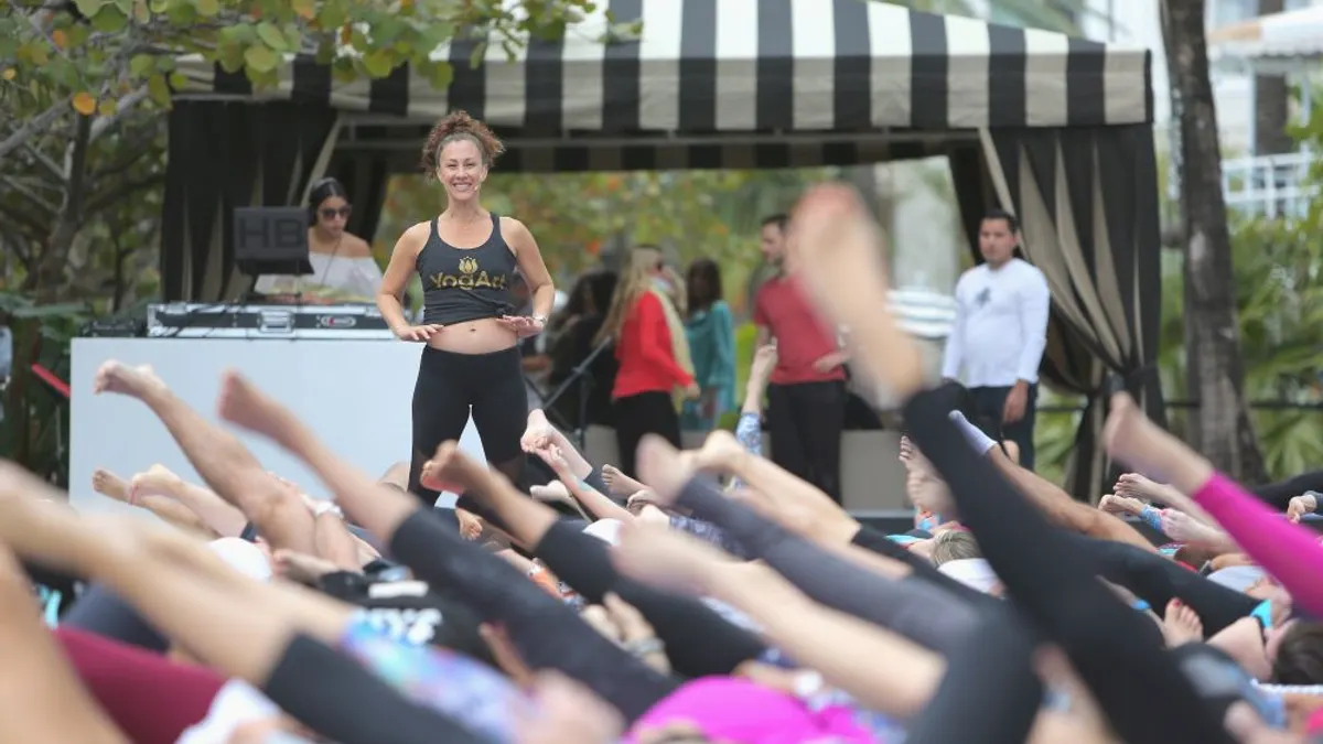 A yoga instructor leading a yoga class