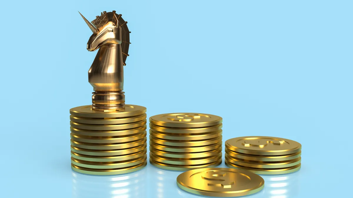 a unicorn chess piece sits on top of a stack of coins