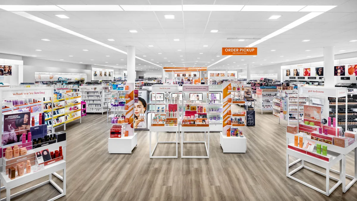 Front entrance of Ulta store with white and orange colored displays