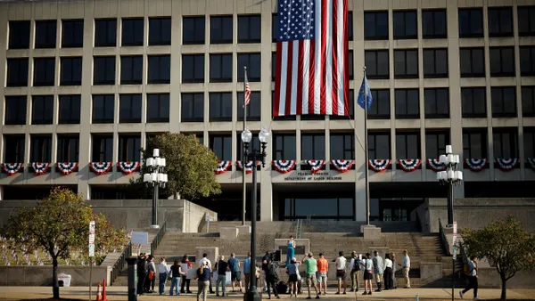 A group of people in front of a building