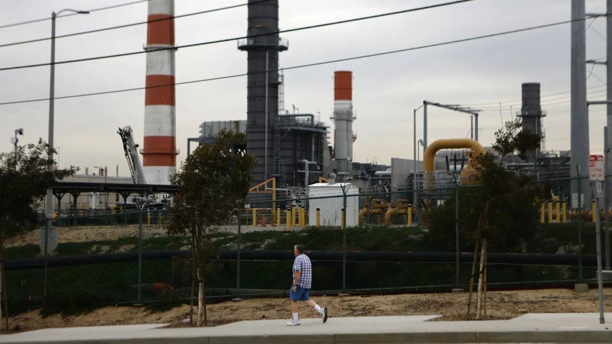 A man walks past the Scattergood Generating Station on February 12, 2019 in El Segundo, California.