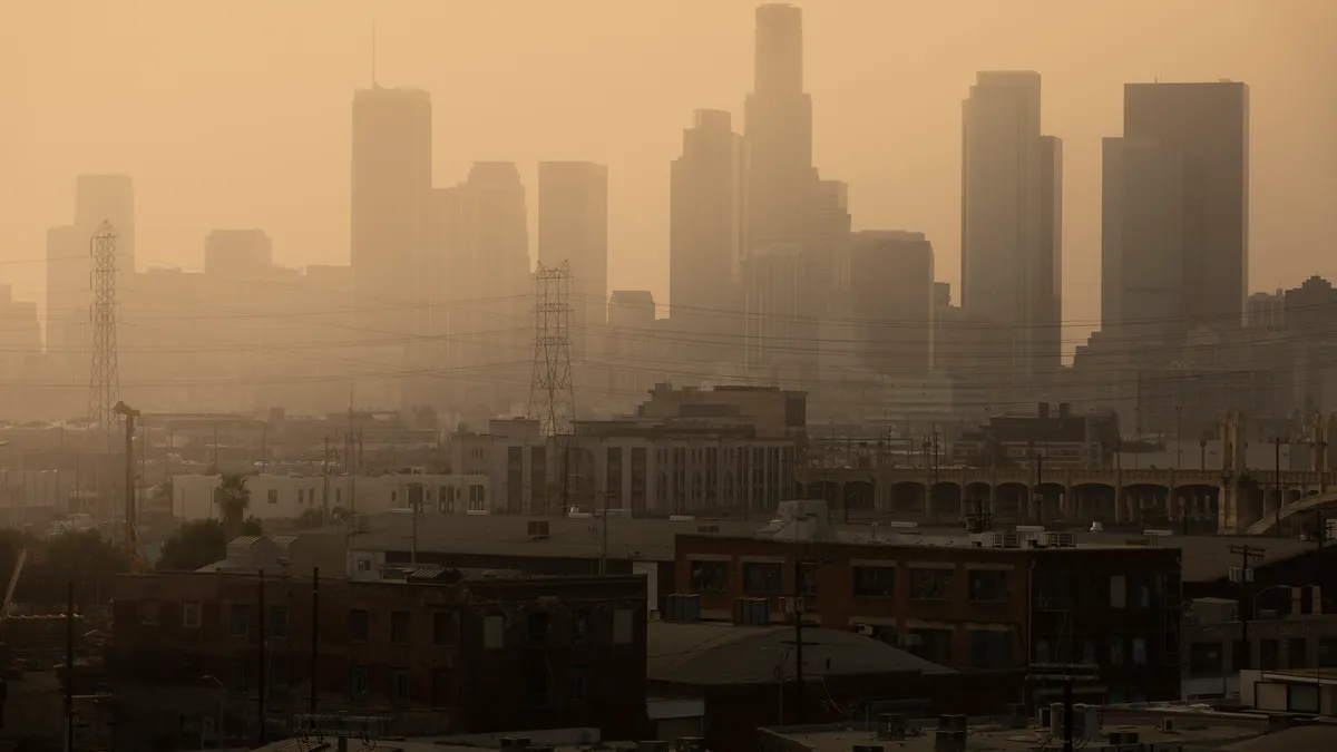 Hazy orange sky over cityscape