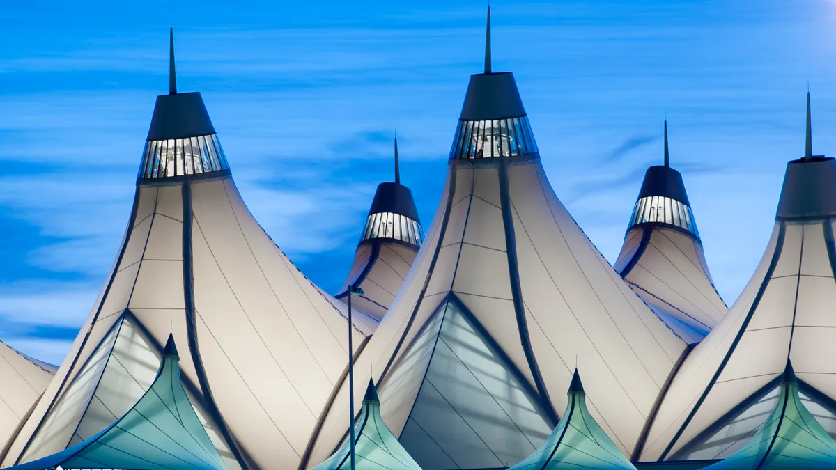 A closeup of the Denver International Airport at sunrise.