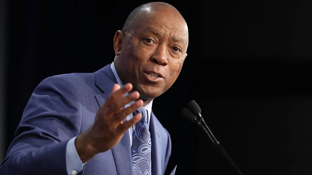 Houston Mayor Sylvester Turner speaks at a podium