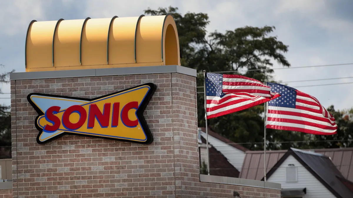 A sign hangs on the side of a Sonic restaurant in 2018.