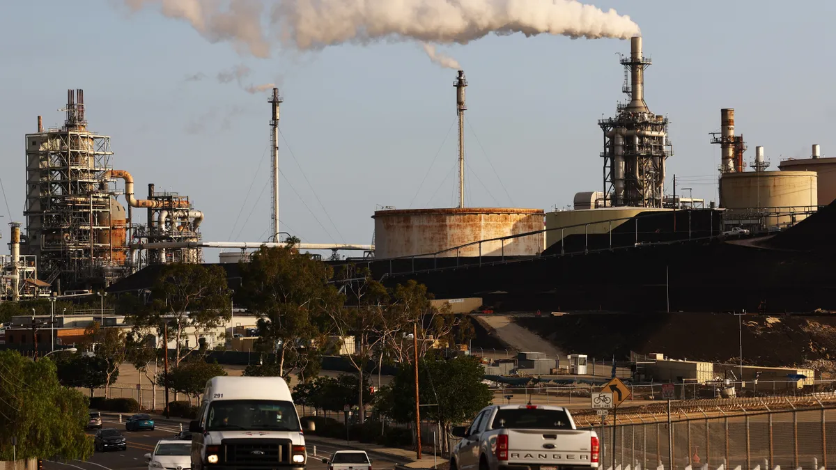 Vehicles pass the Phillips 66 Los Angeles Refinery Wilmington Plant