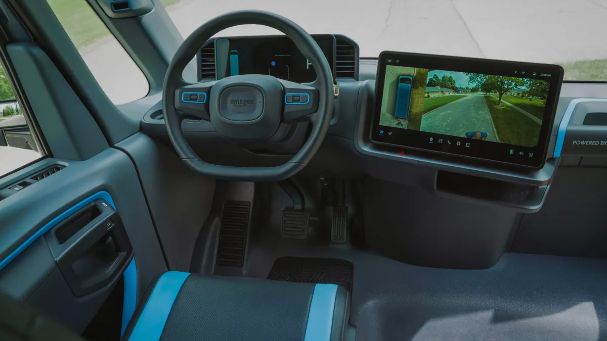 The steering wheel and driver display screen in the custom-built electric delivery van Rivian is supplying to e-commerce giant Amazon.