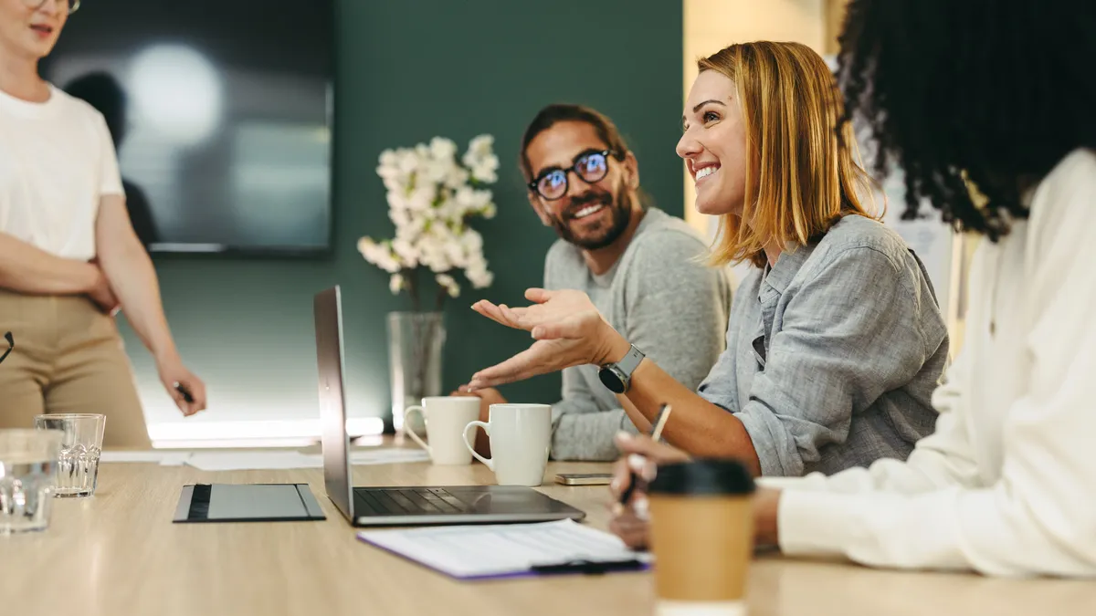 Business woman talking to her colleagues during a meeting