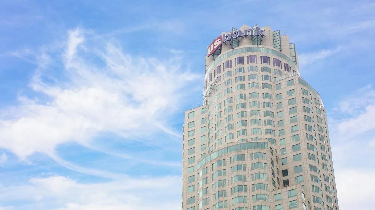 A skyscraper with the name "U.S. Bank" atop it is shown.