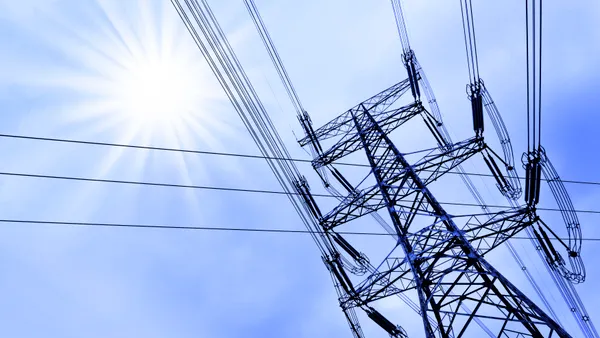 High voltage power tower pylon and line cables.