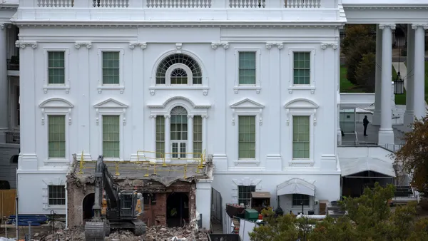 An excavator sits on rubble after the East Wing of the White House was demolished.