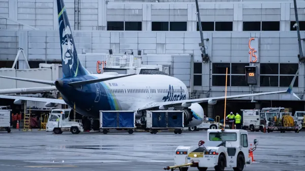 An Alaska Airlines Boeing 737 sits at a gate at the Seattle airport on Jan. 9, 2024