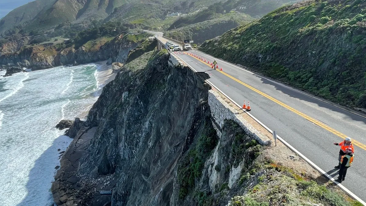 A landscape photograph shows where a chunk of California's Highway 1 fell into the ocean below.