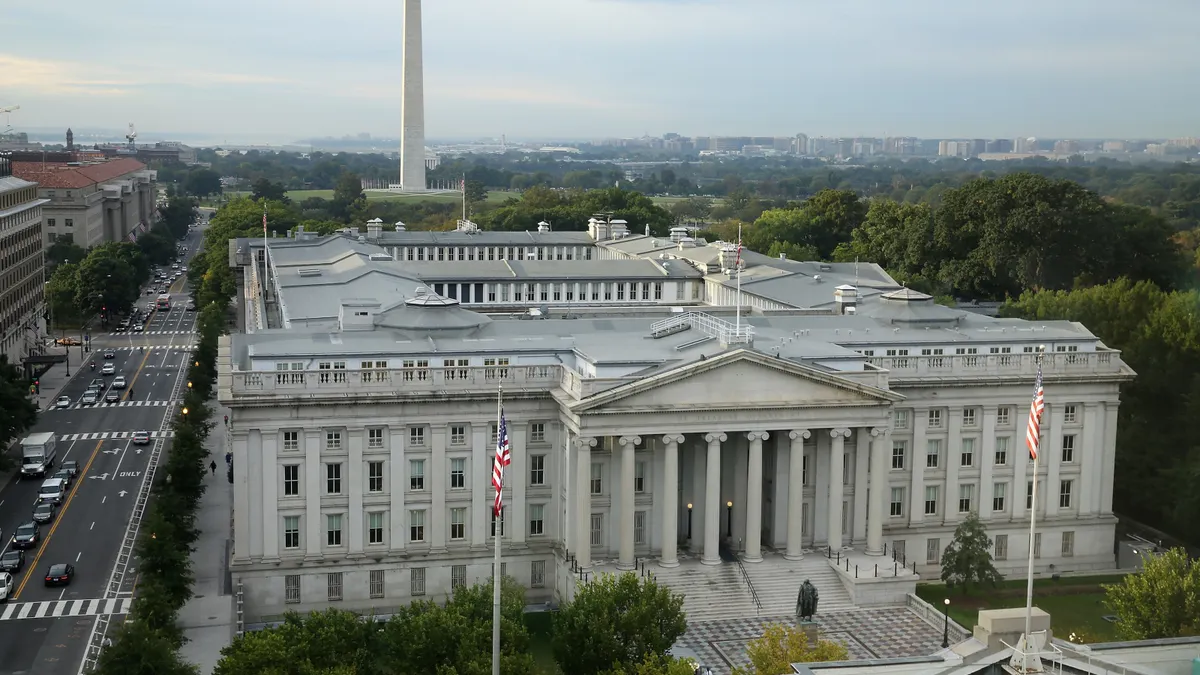A large government building is seen from the sky
