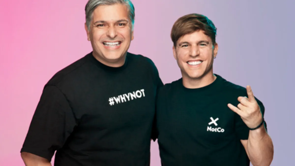 Shot of CMO Fernando Machado linking arms with NotCo CEO Matias Muchnick