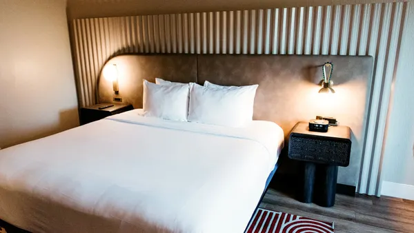 An image shows a guest room at Hotel Solaya in Scottsdale, Arizona.