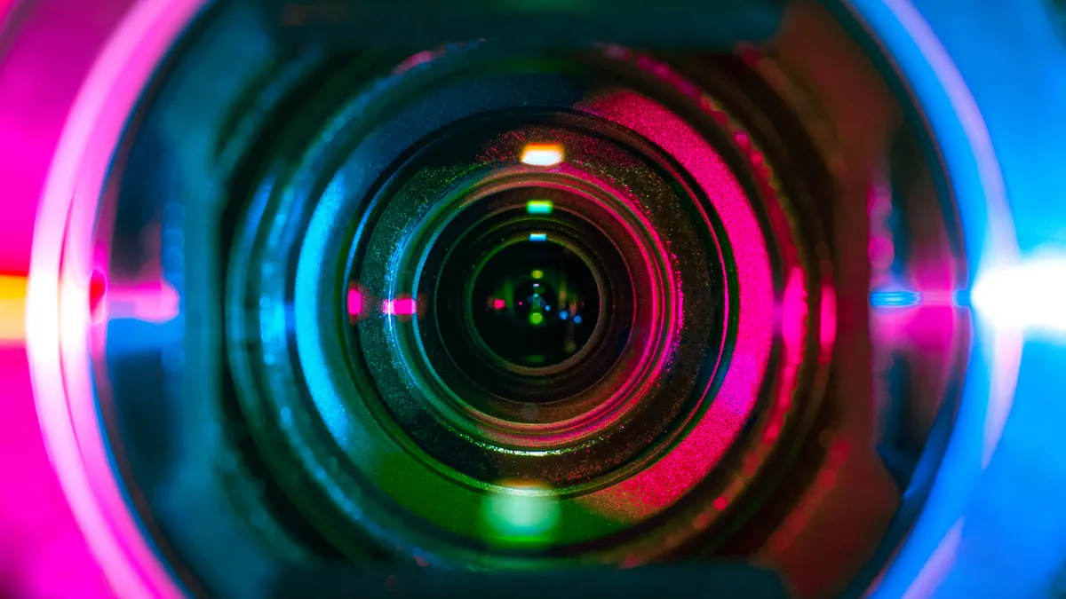 A camera lens is seen up close.