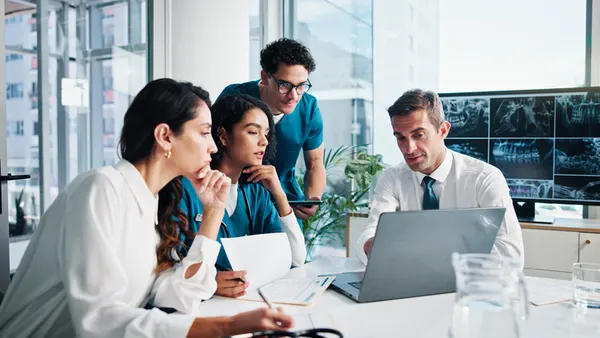 People, doctor and discussion with laptop for meeting, medical planning or procedure at hospital. Group, healthcare workers or employees with technology, documents or x ray screen for surgery results