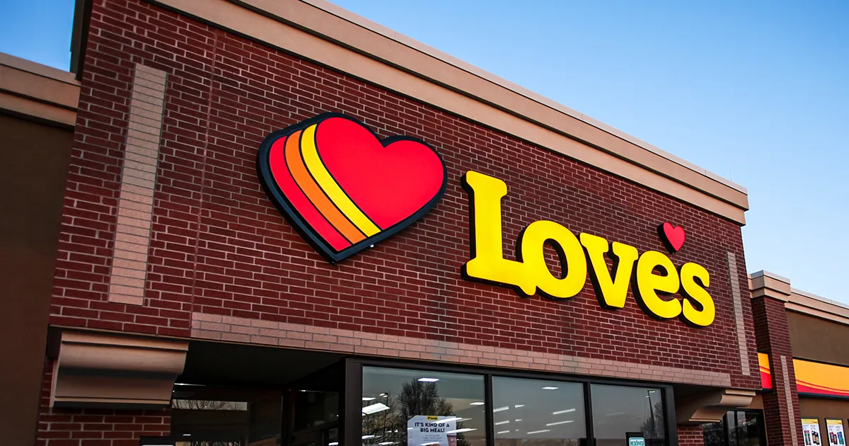 A photo of a Love's Travel Stops & Country Stores sign on a building.