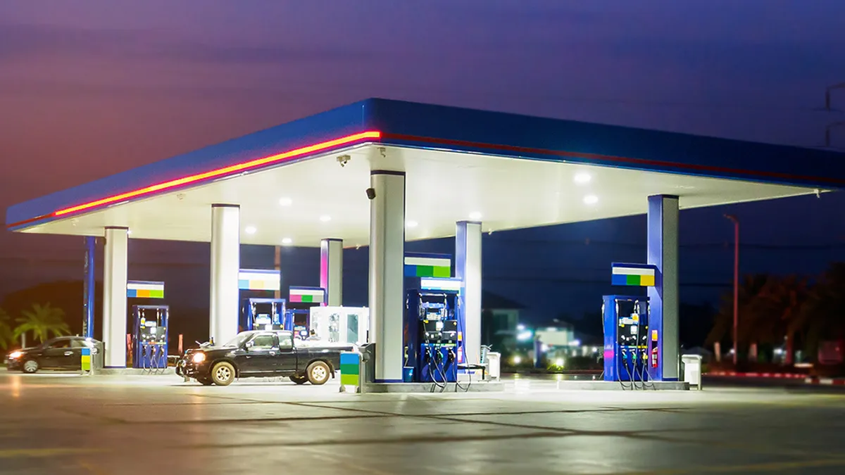 gas station with clouds and sky at sunset