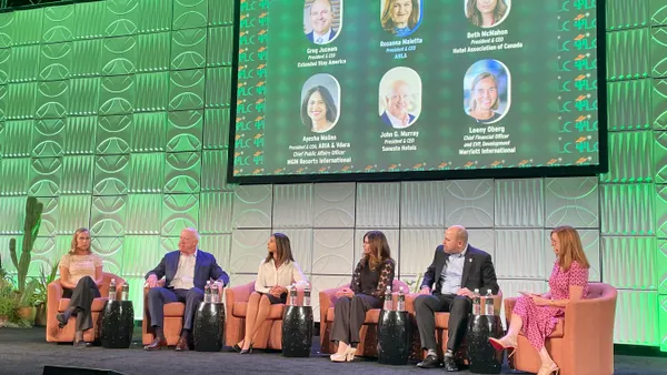 Hotel executives speak on stage at 2025's Lodging Conference.