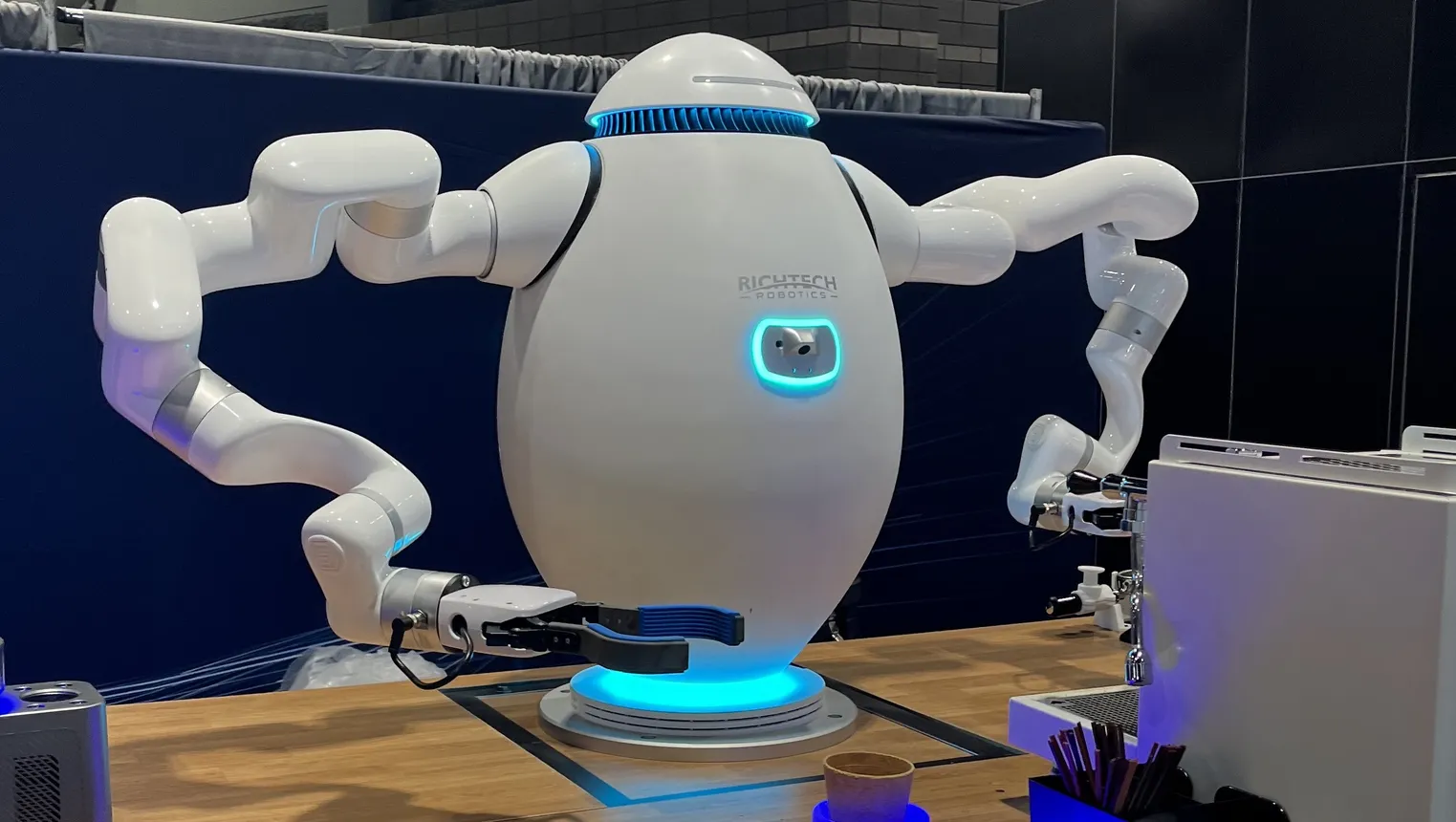 Adam, a robot made by Richtech Robotics, makes an espresso drink at the National Restaurant Association Show in May 2025.