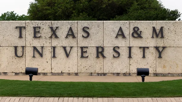 A sign bearing Texas A&M University's name at the institution's entrance.