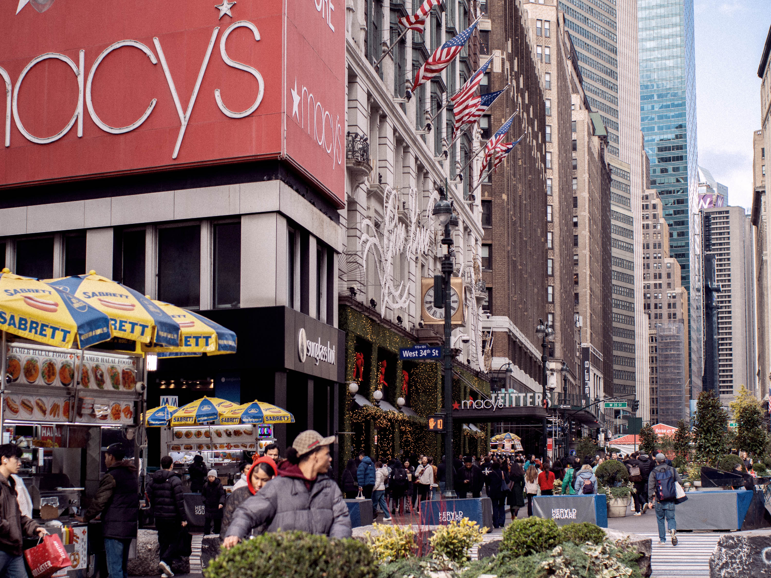 People milling around a city plaza in New York.
