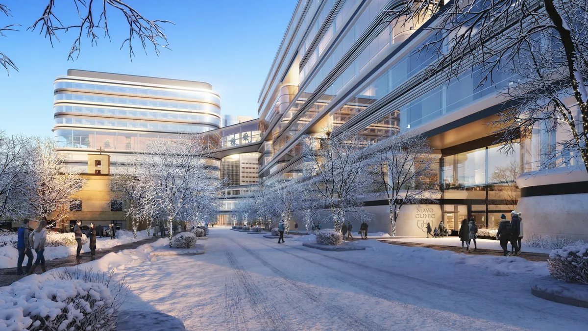 A rendering of a glassy, modern building with many windows and new design in a winter landscape, with snow floating around.