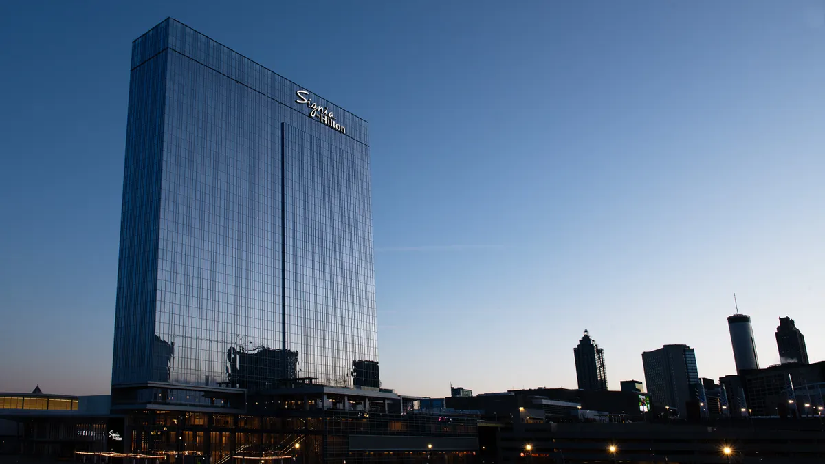 The exterior of the new hotel at sunset.