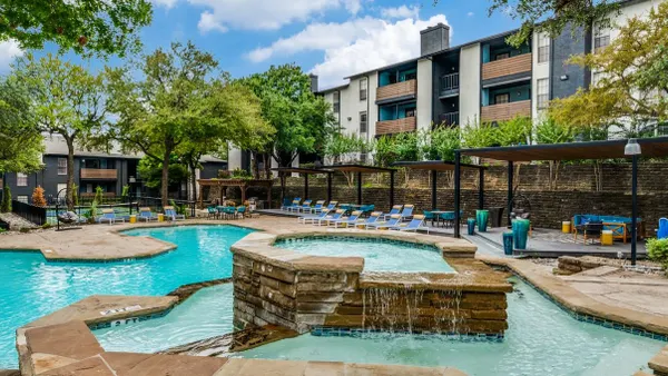Pool surrounded by garden-style apartments