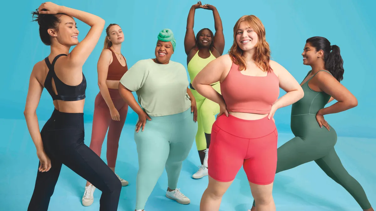 Female models of different sizes pose in athleticwear