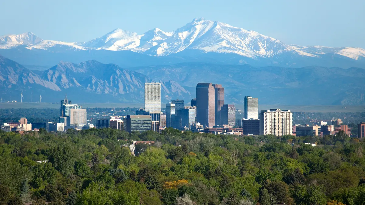 Denver Colorado skyscrapers snowy Longs Peak Rocky Mountains summer - stock photo