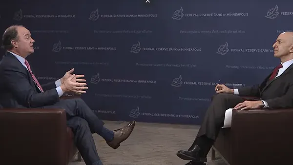 Xcel Energy Chairman, President and CEO Bob Frenzel talks with Minneapolis Fed President Neel Kashkari on Jan. 9, 2026.