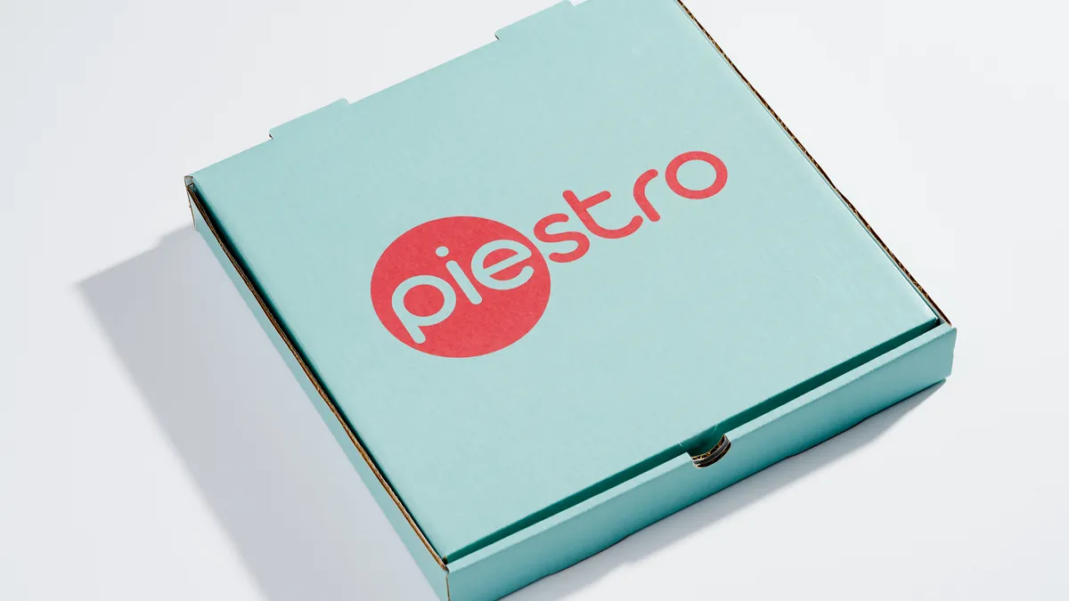 A Piestro branded pizza box.