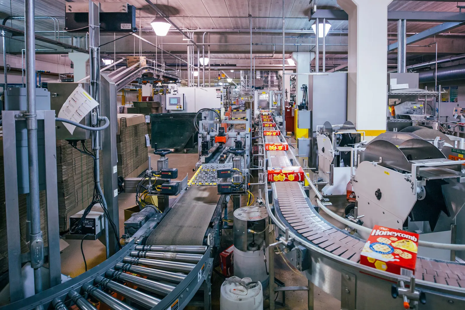 A view of a Post factory with its Honeycomb cereal on a moving belt in Battle Creek, Michigan.