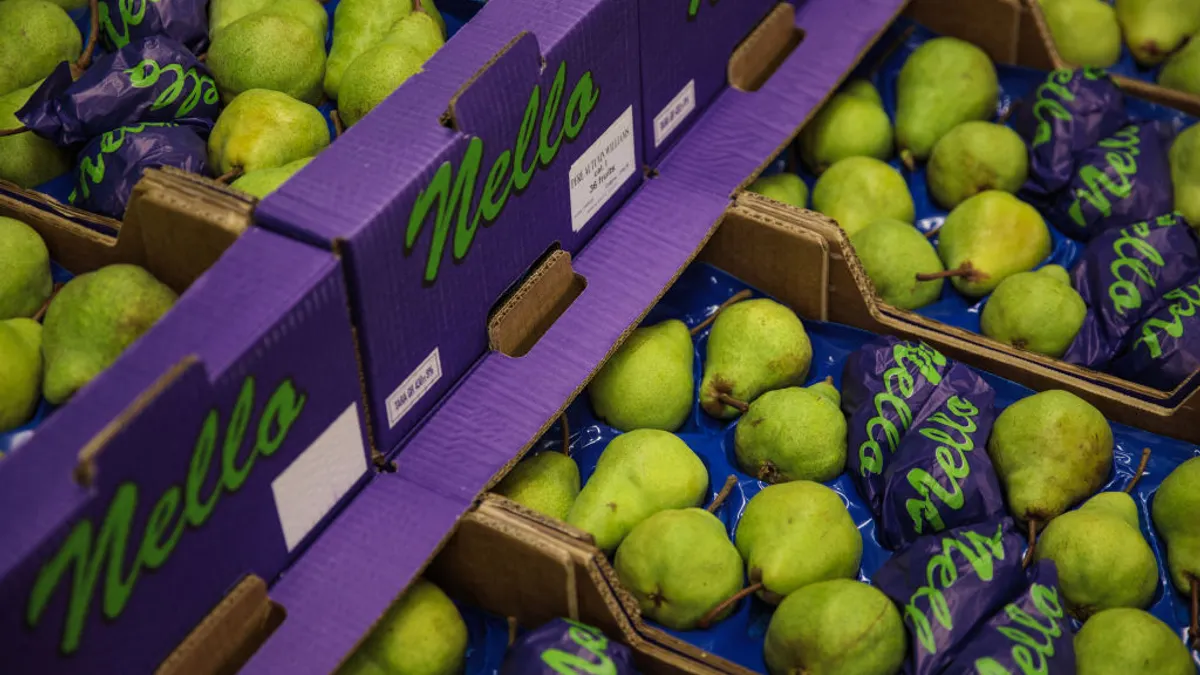 Boxes of pears are packaged for sale