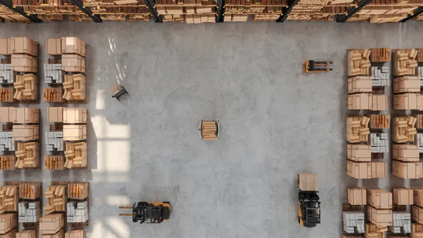 High Angle View Of Warehouse With Forklift, Pallet, AGV And Cardboard Boxes