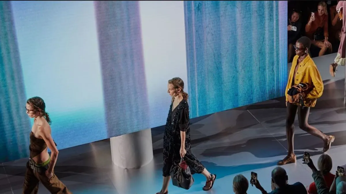 Models wear sandals and spring outfits on the runway at the Miu Miu spring-summer 2024 show during Paris Fashion Week in October 2023.