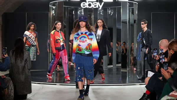 Models walk the runway wearing used items during EBay's Pre-Loved Fashion Week.