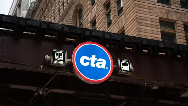 A street sign of Chicago Transit Authority hanging over a bridge