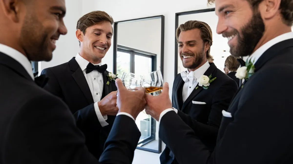 Men in tuxes as part of David's Bridal's partnership with Generation Tux.