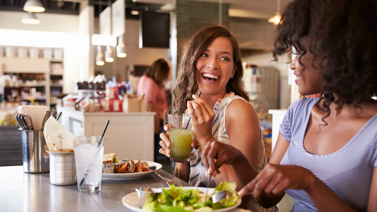 Two people enjoying a meal at a restaurant